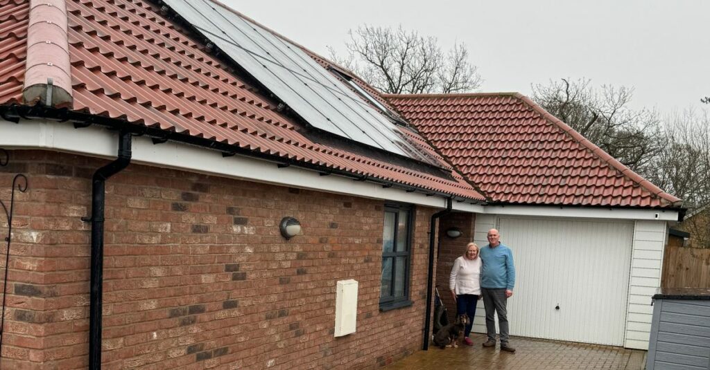 Picture of Solar Together Participants standing in fronto of their solar poweered home