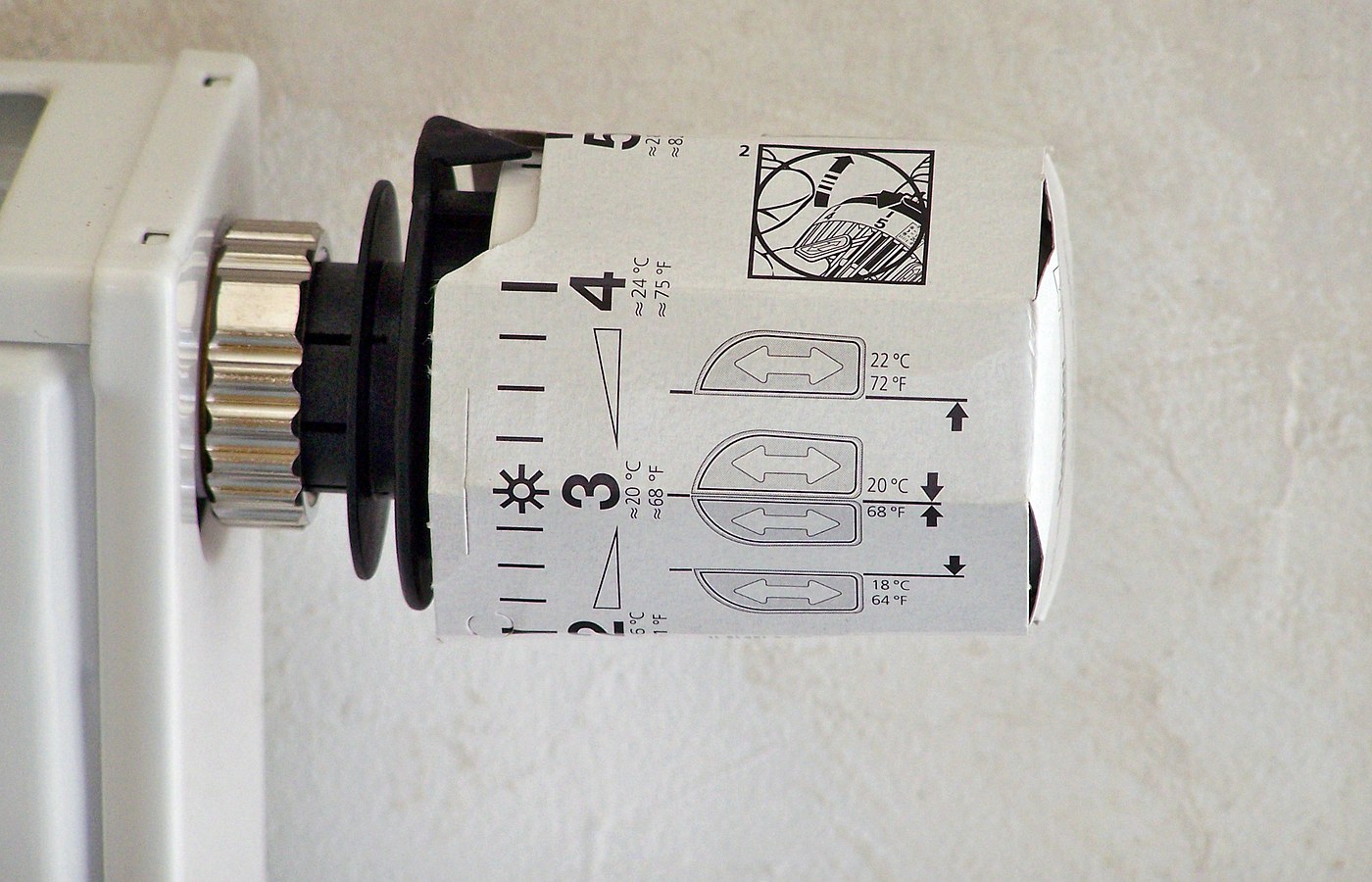 Real photo of thermostatic radiator valve close-up for Radiator reflector panels and valves: where they make sense